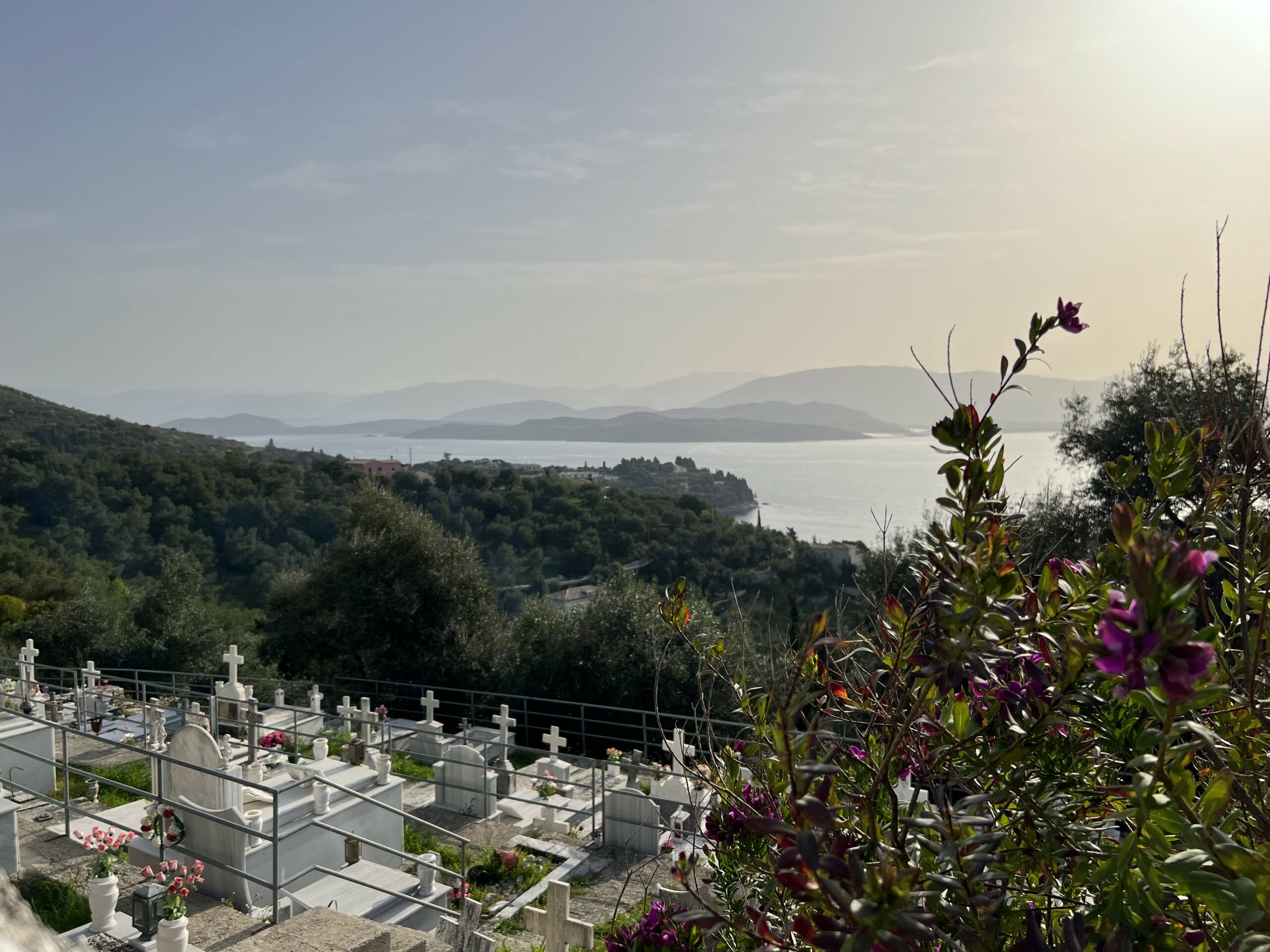 Cemetery on a slope with a beautiful islands and sea in the background