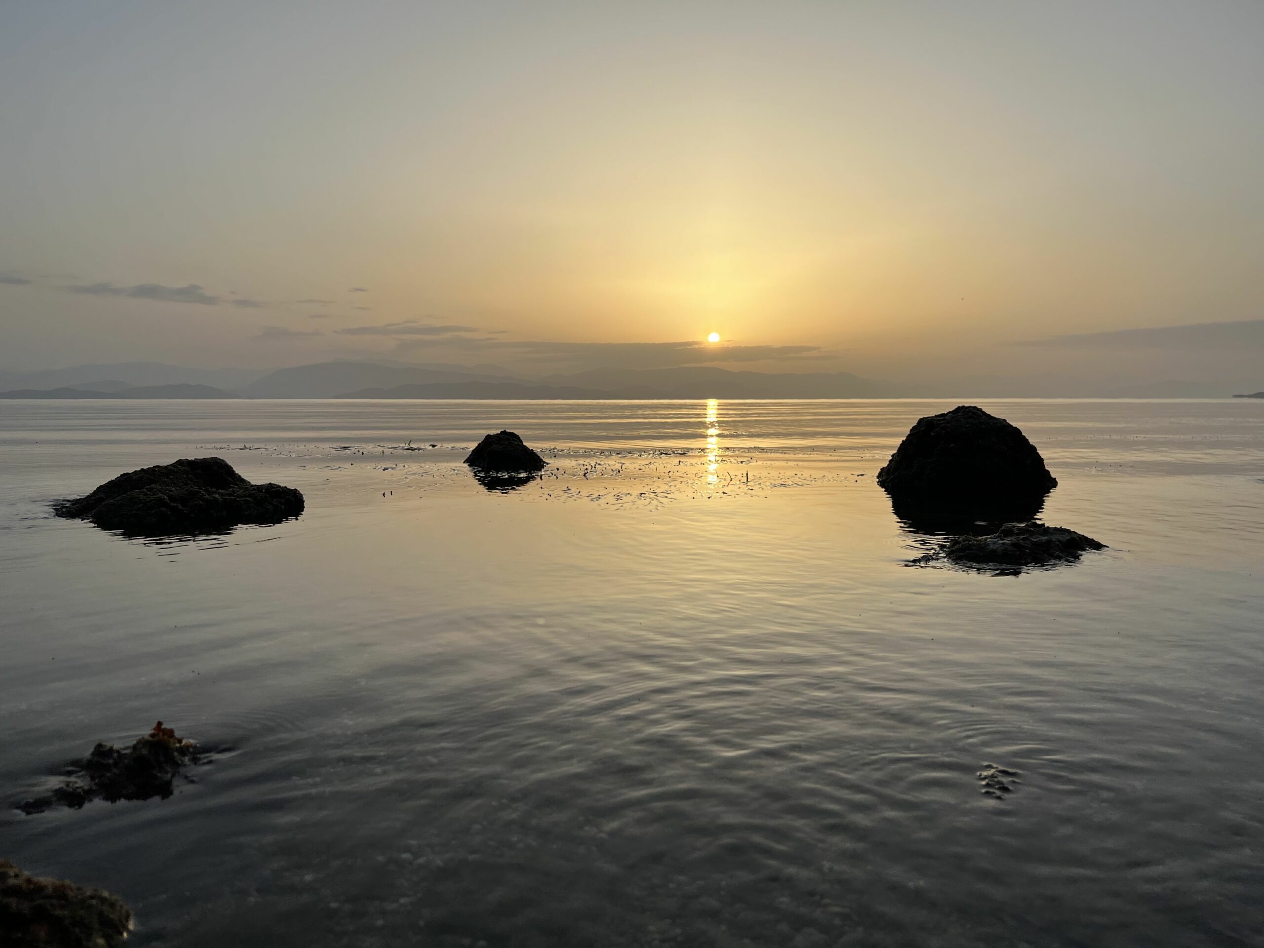 Rocks in the sea on the sunrise background