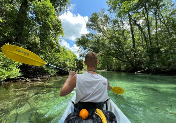 Person swimming in kayak in Weeki Wachee Springs