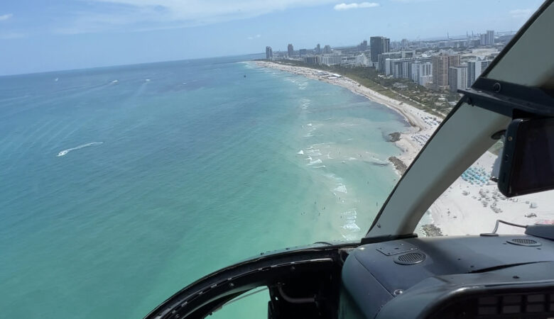 Flying over Miami with a helicopter